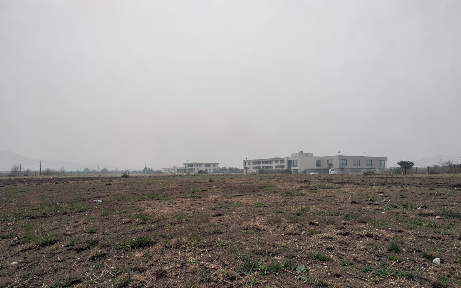 Neutral open site representing the planned Mardan campus