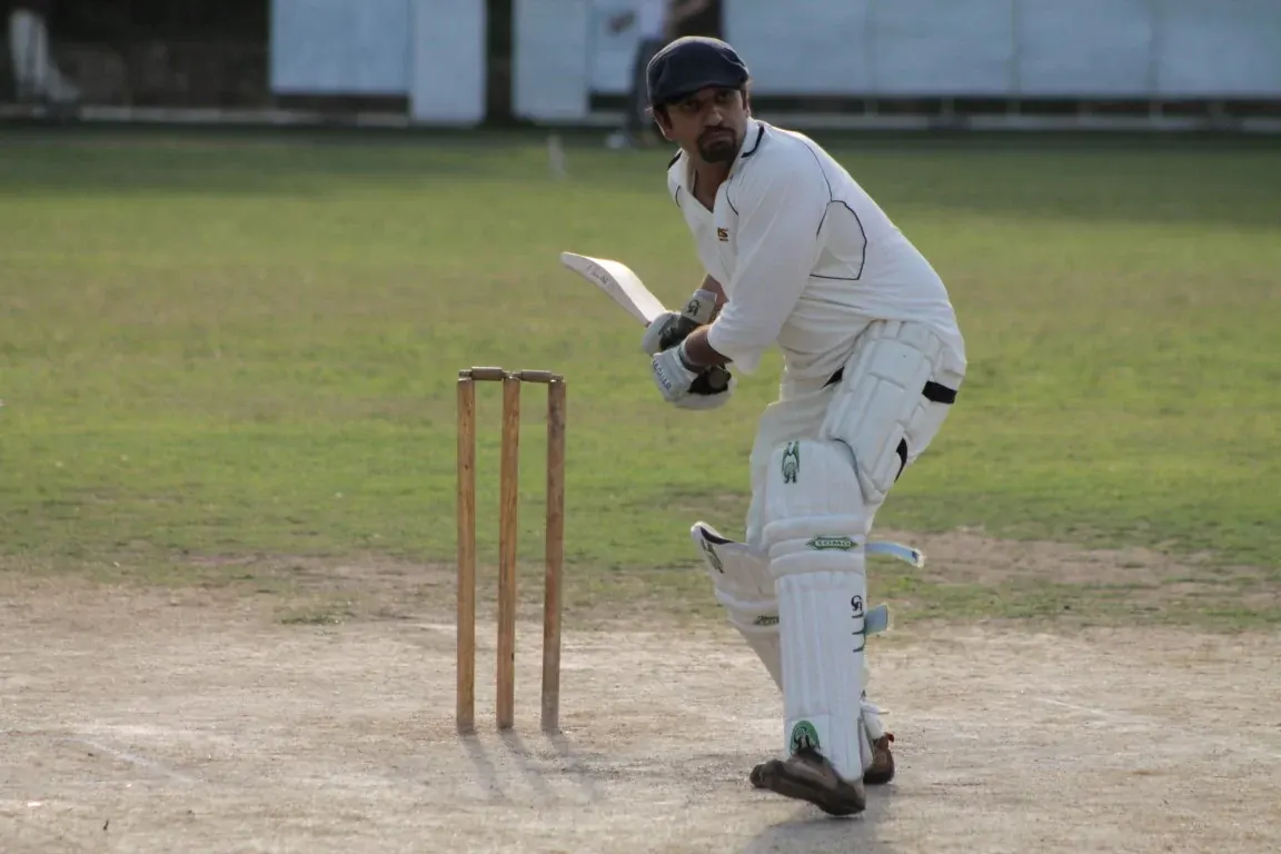 INU cricket bowler in action